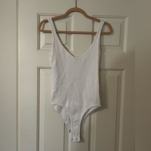 Ripped white tank top bodysuit